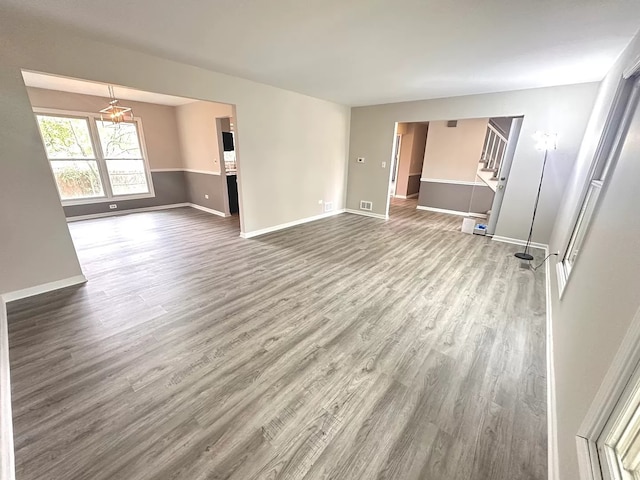 1734 Bishop Way, Mundelein, IL 60060 - spare room with wood finished floors and stairway
