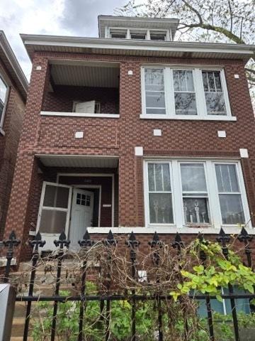 4457 S Sacramento Ave, Chicago, IL 60632 - view of front of house with a balcony and brick siding