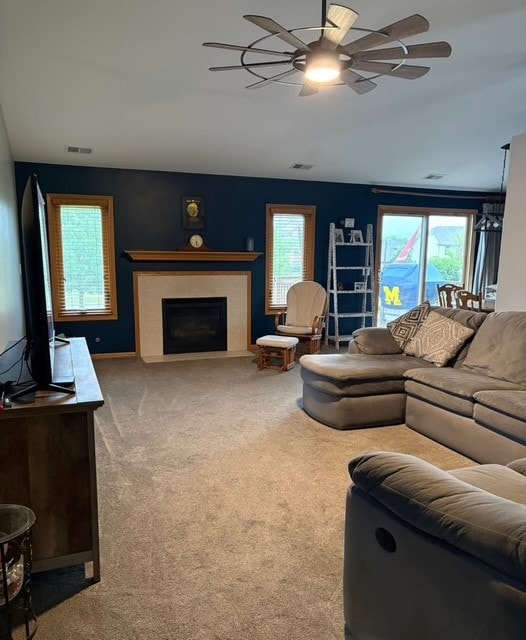 8310 Auburn Ln, Frankfort, IL 60423 - carpeted living room with ceiling fan and a fireplace with flush hearth