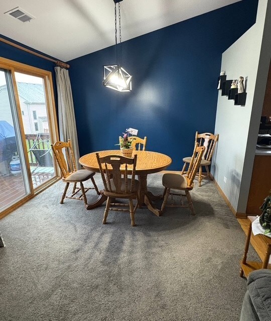 8310 Auburn Ln, Frankfort, IL 60423 - dining area featuring carpet and lofted ceiling