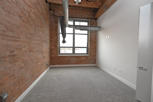 770 W Gladys Ave Unit 606, Chicago, IL 60661 - carpeted spare room featuring brick wall, a towering ceiling, and beamed ceiling