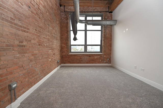 770 W Gladys Ave Unit 606, Chicago, IL 60661 - empty room with carpet floors, brick wall, and a high ceiling