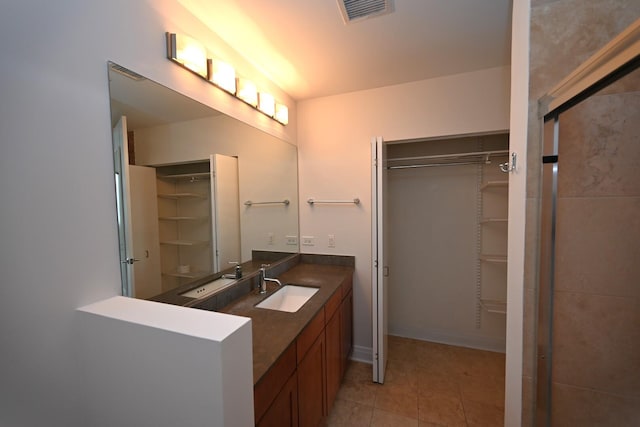 770 W Gladys Ave Unit 606, Chicago, IL 60661 - bathroom with a spacious closet, vanity, and tile patterned flooring
