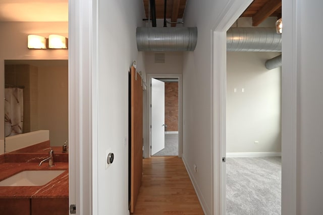 770 W Gladys Ave Unit 606, Chicago, IL 60661 - hallway with a sink and baseboards