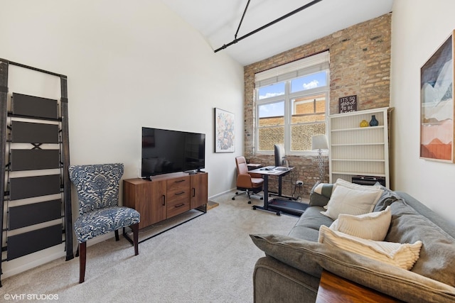 1907 N Milwaukee Ave Unit 307, Chicago, IL 60647 - living room featuring high vaulted ceiling, light colored carpet, and a desk