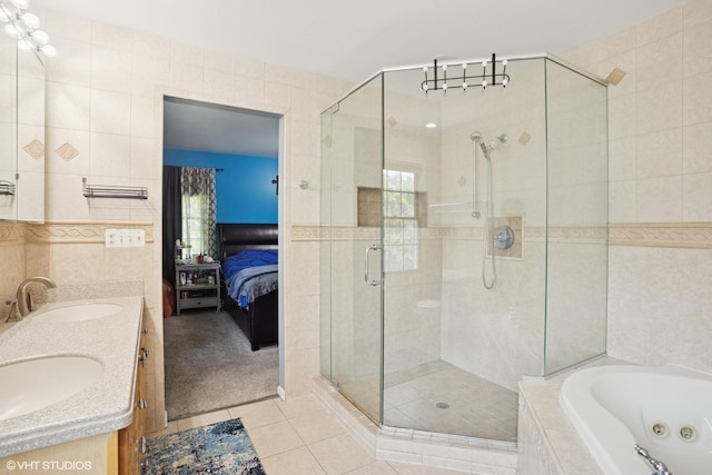 523 N Ela Rd, Barrington, IL 60010 - full bathroom with tile walls, tile patterned floors, a shower stall, a tub with jets, and ensuite bathroom