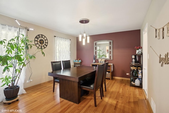 523 N Ela Rd, Barrington, IL 60010 - dining space featuring light wood finished floors and arched walkways
