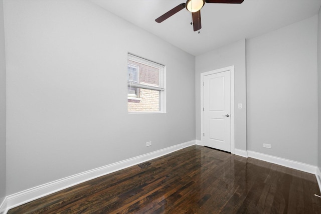 4426 S Artesian Ave, Chicago, IL 60632 - empty room with dark wood-type flooring and a ceiling fan