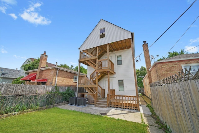4426 S Artesian Ave, Chicago, IL 60632 - back of property featuring a fenced backyard, stairs, a deck, and a patio