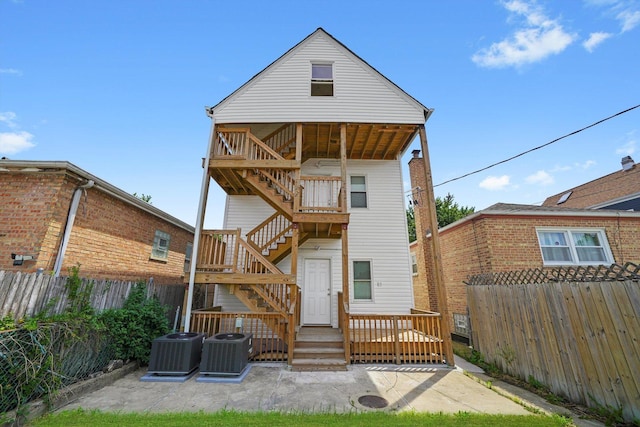 4426 S Artesian Ave, Chicago, IL 60632 - back of house featuring stairway, a fenced backyard, a patio, and a wooden deck