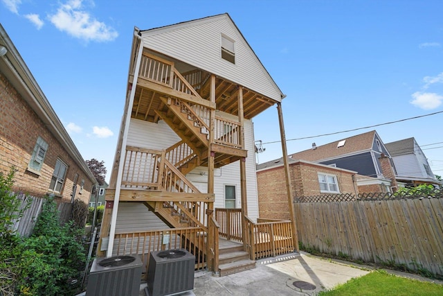 4426 S Artesian Ave, Chicago, IL 60632 - back of property featuring stairs, a patio, and a wooden deck