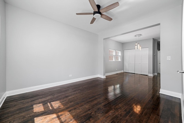 4426 S Artesian Ave, Chicago, IL 60632 - spare room with a ceiling fan, dark wood-style flooring, and a chandelier