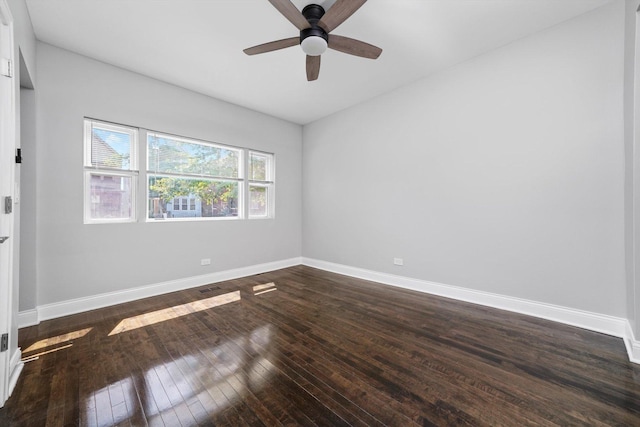 4426 S Artesian Ave, Chicago, IL 60632 - empty room featuring dark wood-type flooring and a ceiling fan