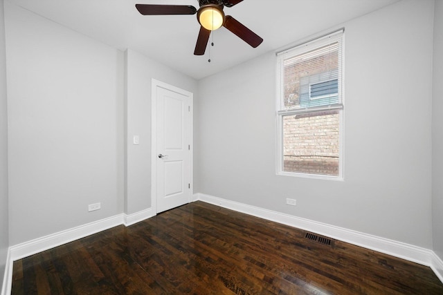 4426 S Artesian Ave, Chicago, IL 60632 - empty room with dark wood-style floors and ceiling fan