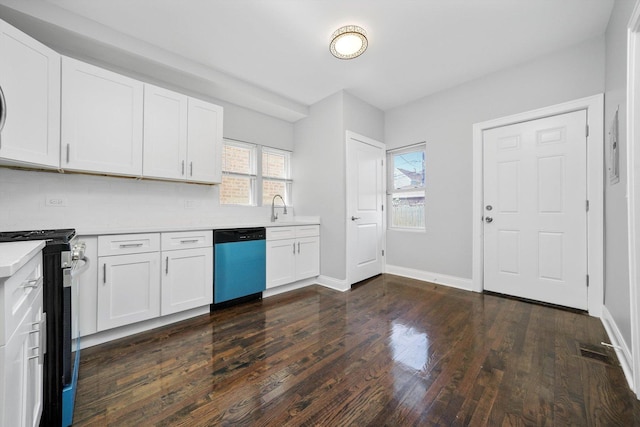 4426 S Artesian Ave, Chicago, IL 60632 - kitchen featuring stainless steel gas range oven, light countertops, dark wood finished floors, dishwasher, and white cabinetry