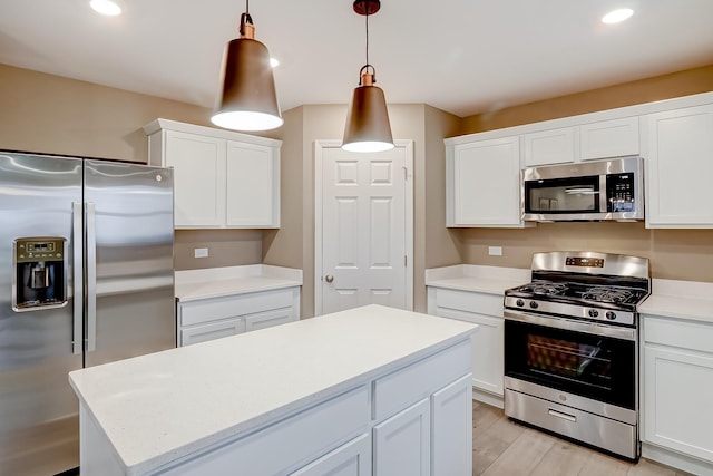 1767 Breton Ave, North Aurora, IL 60542 - kitchen featuring stainless steel appliances, white cabinets, a kitchen island, recessed lighting, and decorative light fixtures