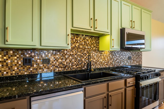 2665 W Warren Blvd Unit 3, Chicago, IL 60612 - kitchen featuring black range with gas stovetop, dishwashing machine, and green cabinets