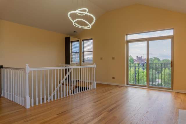 2665 W Warren Blvd Unit 3, Chicago, IL 60612 - unfurnished room with a chandelier, wood finished floors, and lofted ceiling