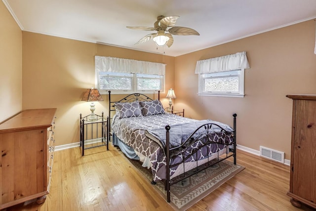 859 S Mount Prospect Rd, Des Plaines, IL 60016 - bedroom featuring light wood-style flooring, crown molding, and a ceiling fan