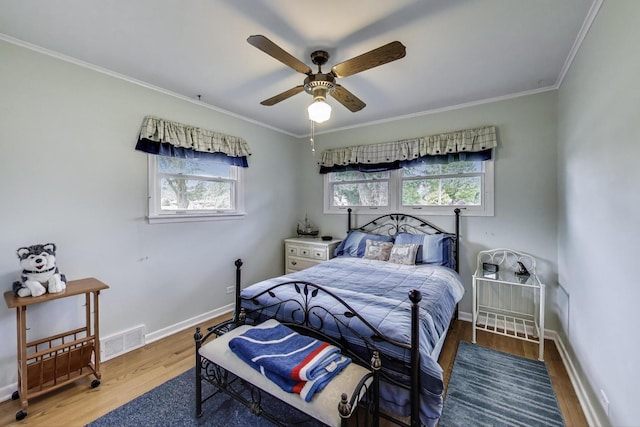 859 S Mount Prospect Rd, Des Plaines, IL 60016 - bedroom with wood finished floors, ornamental molding, and a ceiling fan