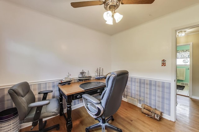 859 S Mount Prospect Rd, Des Plaines, IL 60016 - office area featuring a wainscoted wall, wood finished floors, wallpapered walls, ceiling fan, and ornamental molding