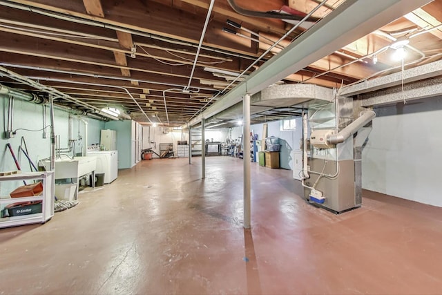 859 S Mount Prospect Rd, Des Plaines, IL 60016 - below grade area featuring heating unit and washer and clothes dryer
