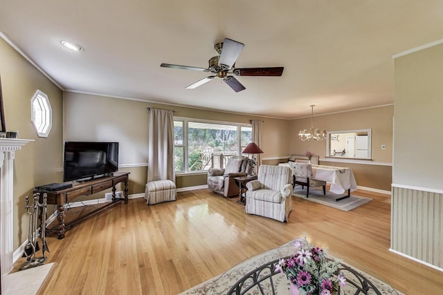 859 S Mount Prospect Rd, Des Plaines, IL 60016 - living area featuring a chandelier, wood finished floors, ornamental molding, and ceiling fan