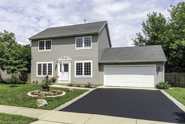 2004 Pine Dr, Mchenry, IL 60051 - colonial house with driveway, a garage, and a shingled roof