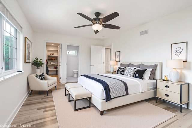 2004 Pine Dr, Mchenry, IL 60051 - bedroom featuring light wood-style flooring, multiple windows, and ensuite bath