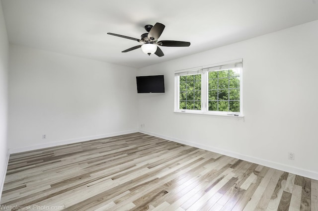 2004 Pine Dr, Mchenry, IL 60051 - spare room featuring wood finished floors and ceiling fan