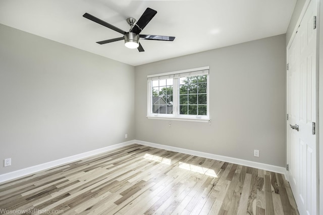 2004 Pine Dr, Mchenry, IL 60051 - unfurnished bedroom featuring a closet, light wood-style flooring, and a ceiling fan