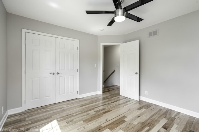 2004 Pine Dr, Mchenry, IL 60051 - unfurnished bedroom with light wood-style floors, a closet, and ceiling fan