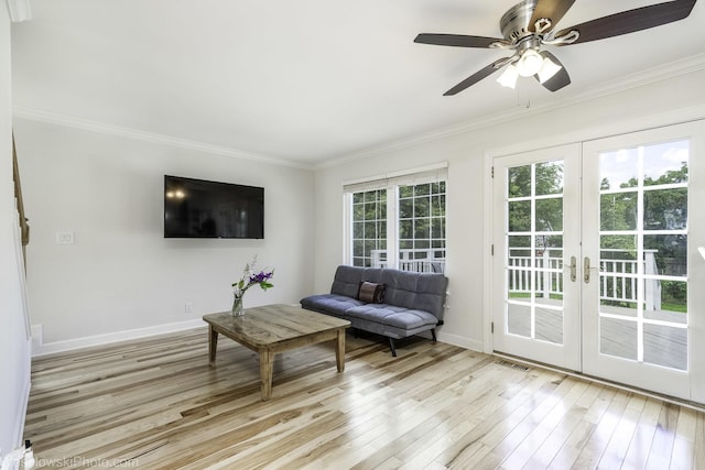 2004 Pine Dr, Mchenry, IL 60051 - living area featuring crown molding, light wood-type flooring, french doors, and ceiling fan