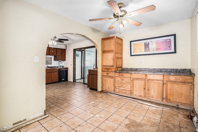 3038 225th St, Sauk Village, IL 60411 - kitchen with ceiling fan, arched walkways, dark countertops, and black dishwasher
