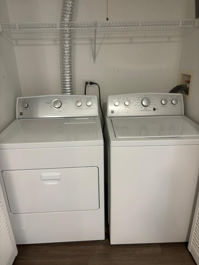 59 S Treehouse Ln S Unit 59, Round Lake, IL 60073 - laundry room with washer and dryer and dark wood-type flooring
