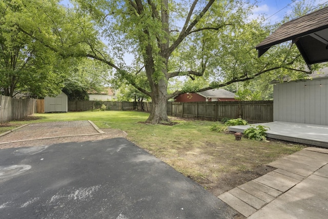 526 S Calumet Ave, Aurora, IL 60506 - fenced backyard featuring a storage shed and a patio