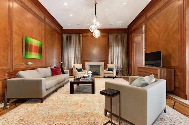 189 E Lake Shore Dr Unit Ph18, Chicago, IL 60611 - living area with recessed lighting, crown molding, wooden walls, and a fireplace