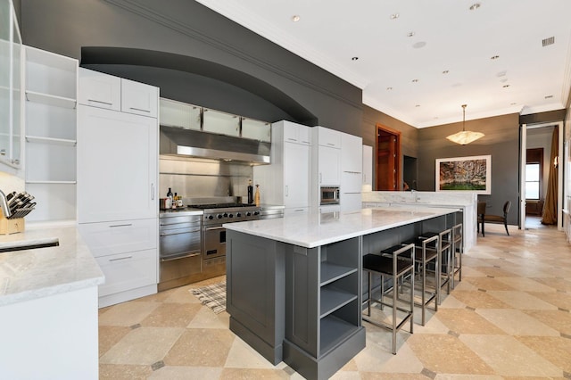 189 E Lake Shore Dr Unit Ph18, Chicago, IL 60611 - kitchen with open shelves, white cabinets, ornamental molding, under cabinet range hood, and a breakfast bar