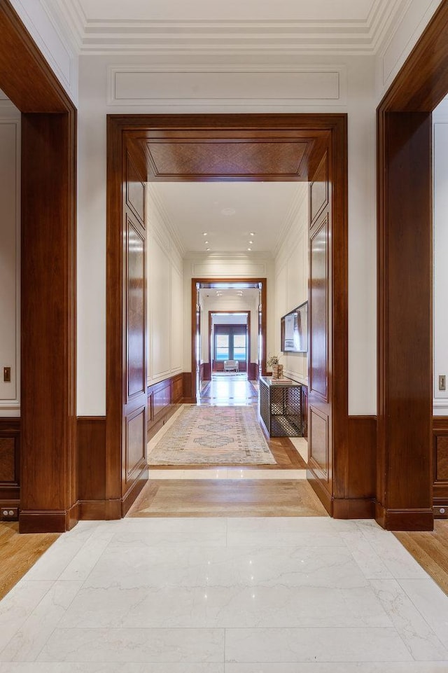 189 E Lake Shore Dr Unit Ph18, Chicago, IL 60611 - hall featuring crown molding, light wood-style floors, and a decorative wall