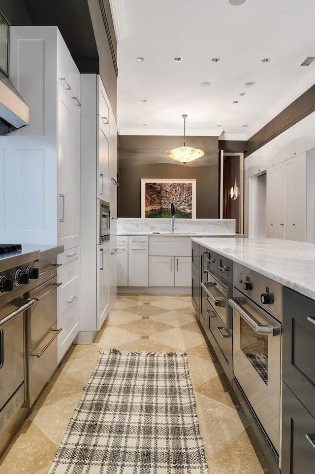 189 E Lake Shore Dr Unit Ph18, Chicago, IL 60611 - kitchen with ornamental molding, light stone countertops, decorative light fixtures, custom exhaust hood, and oven