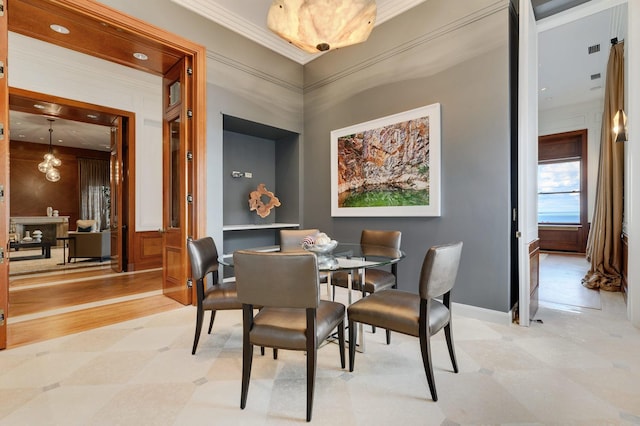 189 E Lake Shore Dr Unit Ph18, Chicago, IL 60611 - dining room featuring light flooring and crown molding