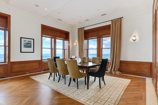 189 E Lake Shore Dr Unit Ph18, Chicago, IL 60611 - dining room with a decorative wall, ornamental molding, and a water view