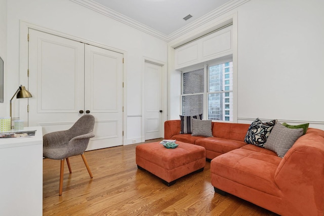 189 E Lake Shore Dr Unit Ph18, Chicago, IL 60611 - living room featuring crown molding and light wood-style floors