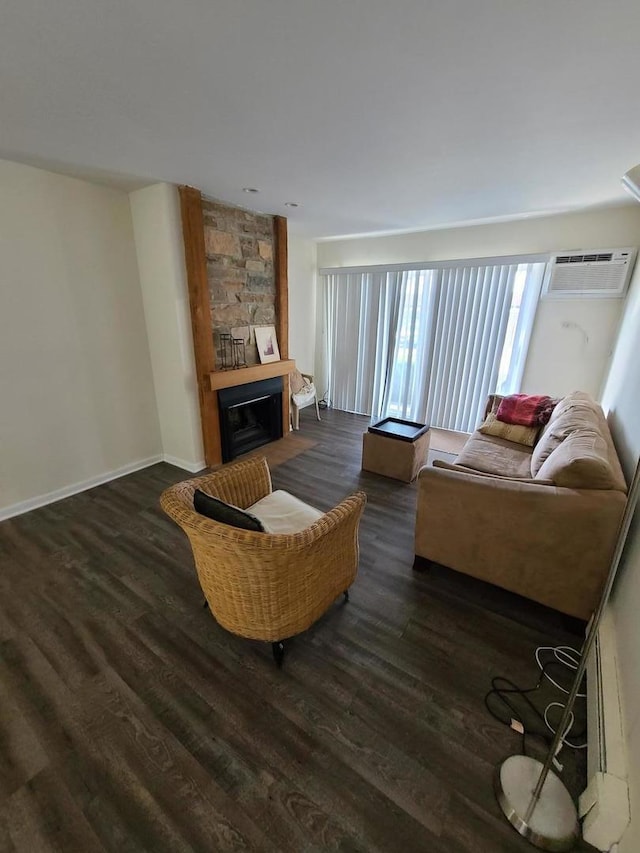 745 Grove Dr Unit 103, Buffalo Grove, IL 60089 - living room with dark wood-type flooring, a large fireplace, and a wall unit AC