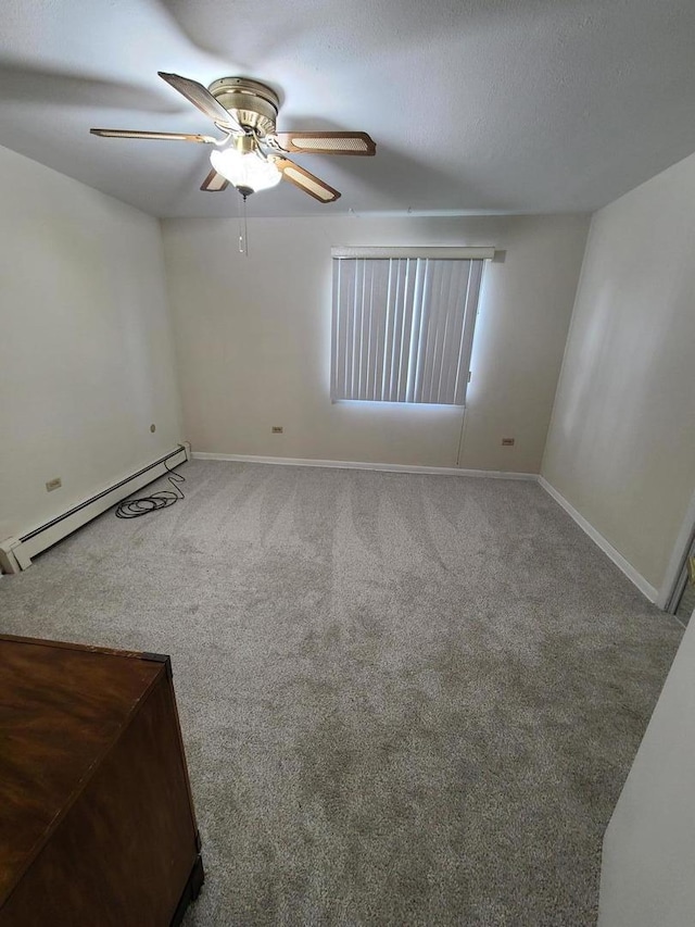 745 Grove Dr Unit 103, Buffalo Grove, IL 60089 - carpeted spare room with a baseboard radiator and ceiling fan