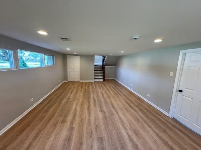 535 Florian Dr, Des Plaines, IL 60016 - below grade area with wood finished floors, stairway, and recessed lighting