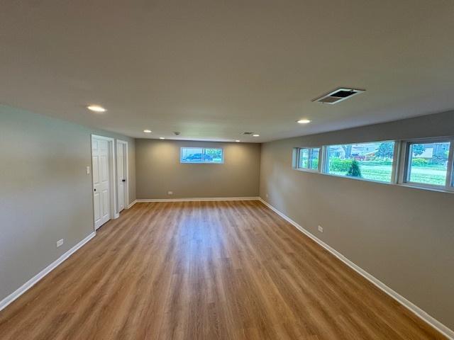 535 Florian Dr, Des Plaines, IL 60016 - empty room featuring wood finished floors and recessed lighting