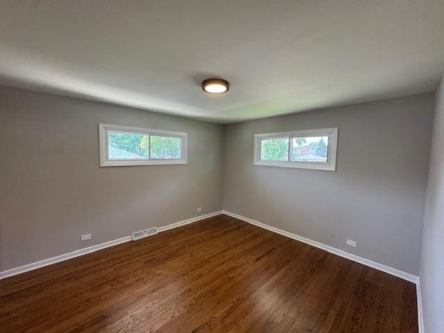 535 Florian Dr, Des Plaines, IL 60016 - spare room featuring healthy amount of natural light and dark wood-style floors