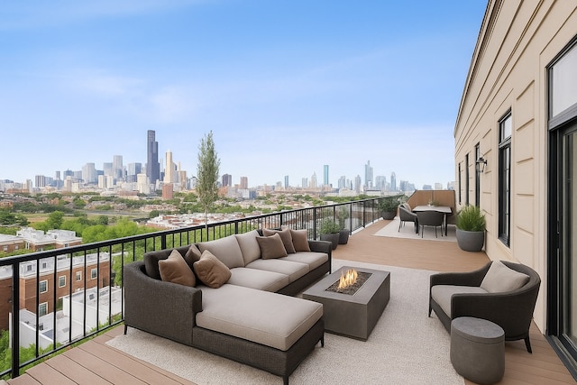 1524 S Sangamon St Unit 802, Chicago, IL 60608 - wooden deck featuring a view of skyline and an outdoor living space with a fire pit