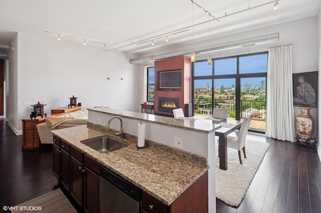 1524 S Sangamon St Unit 802, Chicago, IL 60608 - kitchen with open floor plan, a large fireplace, dishwasher, a center island with sink, and dark wood-style floors